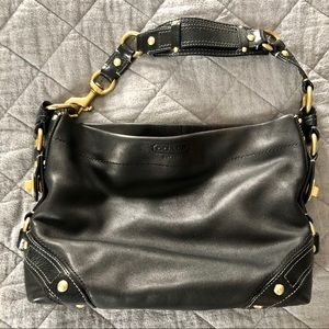 COACH hobo-style leather bag with gold accents